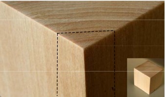 Bloque cúbico de madera de tilo con la cara de la testa marcada