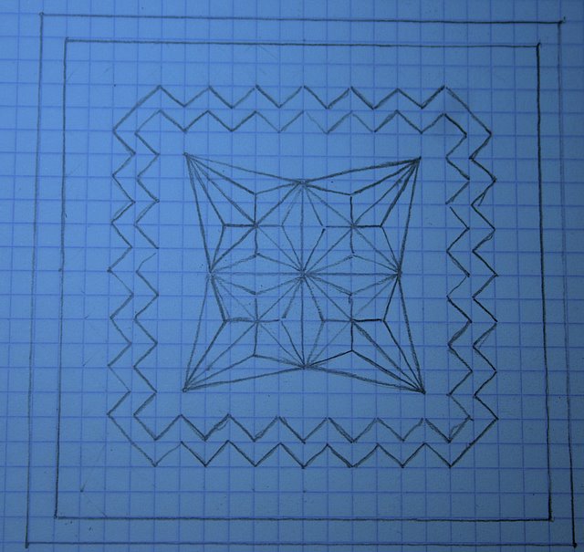 El tercer diseño sobre papel cuadriculado: estrella central y borde en zig-zag
